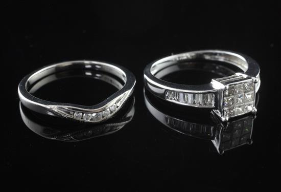 A modern 18ct white gold and diamond cluster tablet ring and a platinum and five stone diamond ring, sizes J & K.